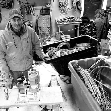 Person working in a workshop with tools and equipment